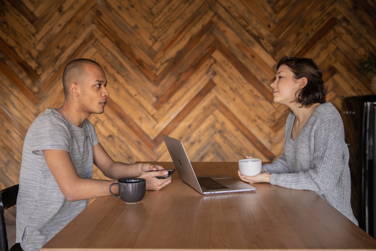 Man and woman discussing politics in the kitchen